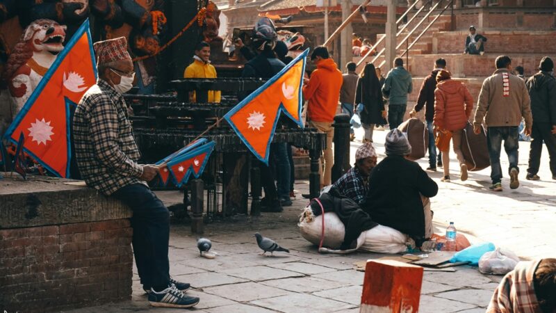 People holding Nepalese flags