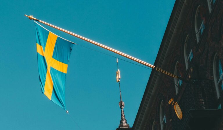 Swedish flag hanging from a building