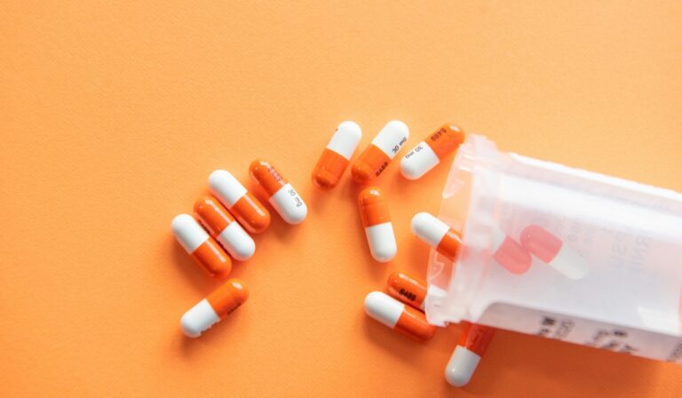 Pills spilling out of a bottle