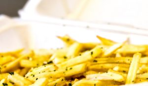 French fries in styrofoam container