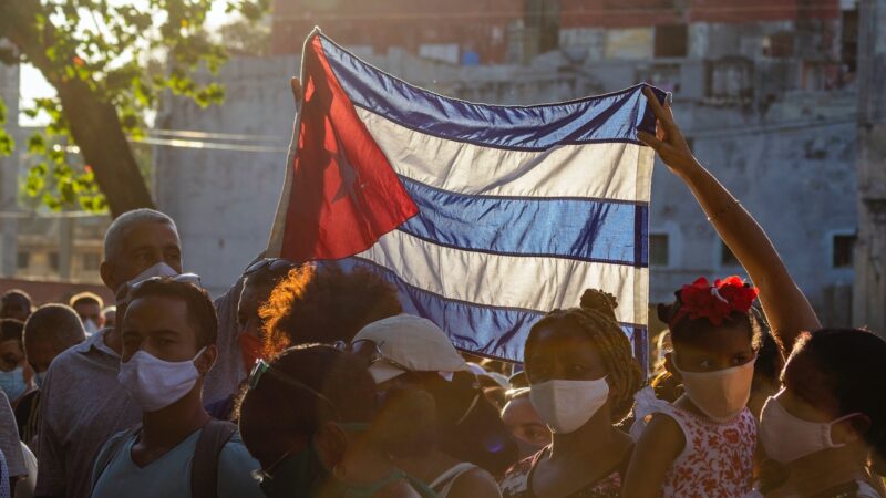 People raising Cuban flag