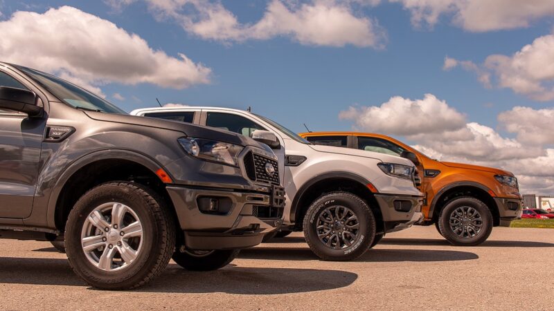 Three Ford cars