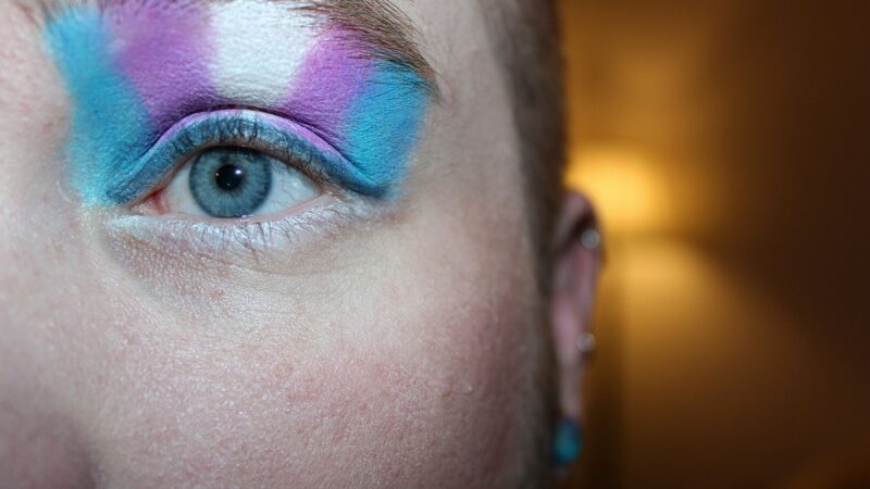 Person with trans flag eye shadow