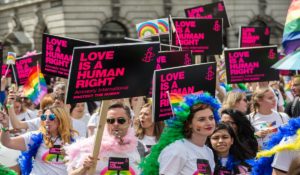 A group of people participate in LGBTQ March