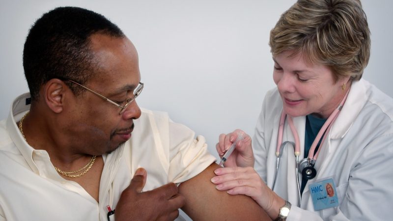 A man receiving flu shot