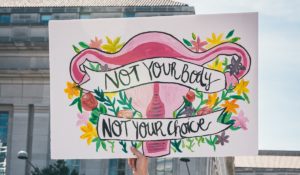 "Not Your Body, Not Your Choice" protest sign