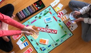 People playing Monopoly