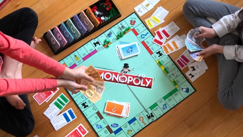 People playing Monopoly