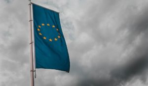 EU flag against overcast sky