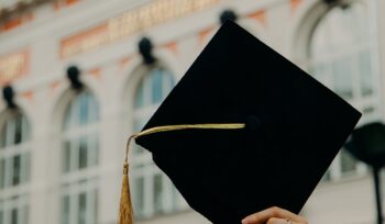 Commencement cap held in the air