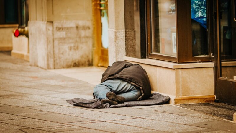 Houseless person lying on the ground