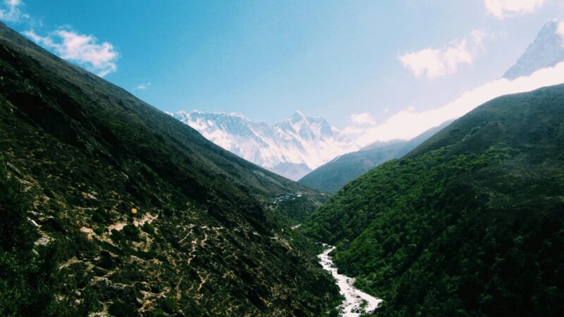 Nepal river valley with mountains in background